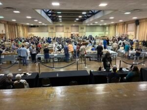 A large crowd of book lovers seeking deals and reuniting with friends. A wonderful time for everyone!