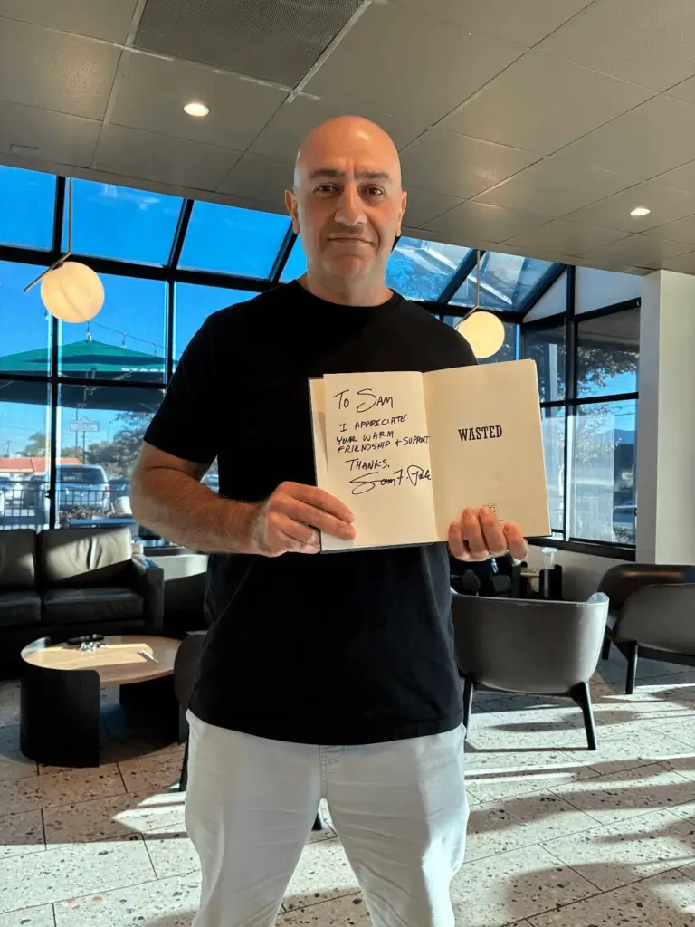 Another Starbucks pal, Sam, brings his copy to get signed by me, Sam